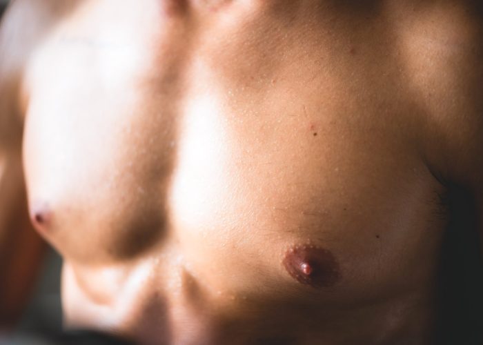close-up-of-muscle-strength-of-male-handsome-sport-2023-11-27-05-13-00-utc-scaled.jpg gynecomastia surgery in Gurgaon