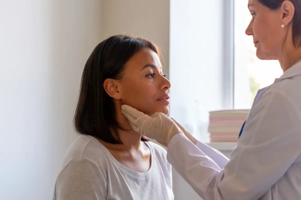 laryngist-examing-throat-of-female-patient-visitin-2026-03-09-08-59-54-utc